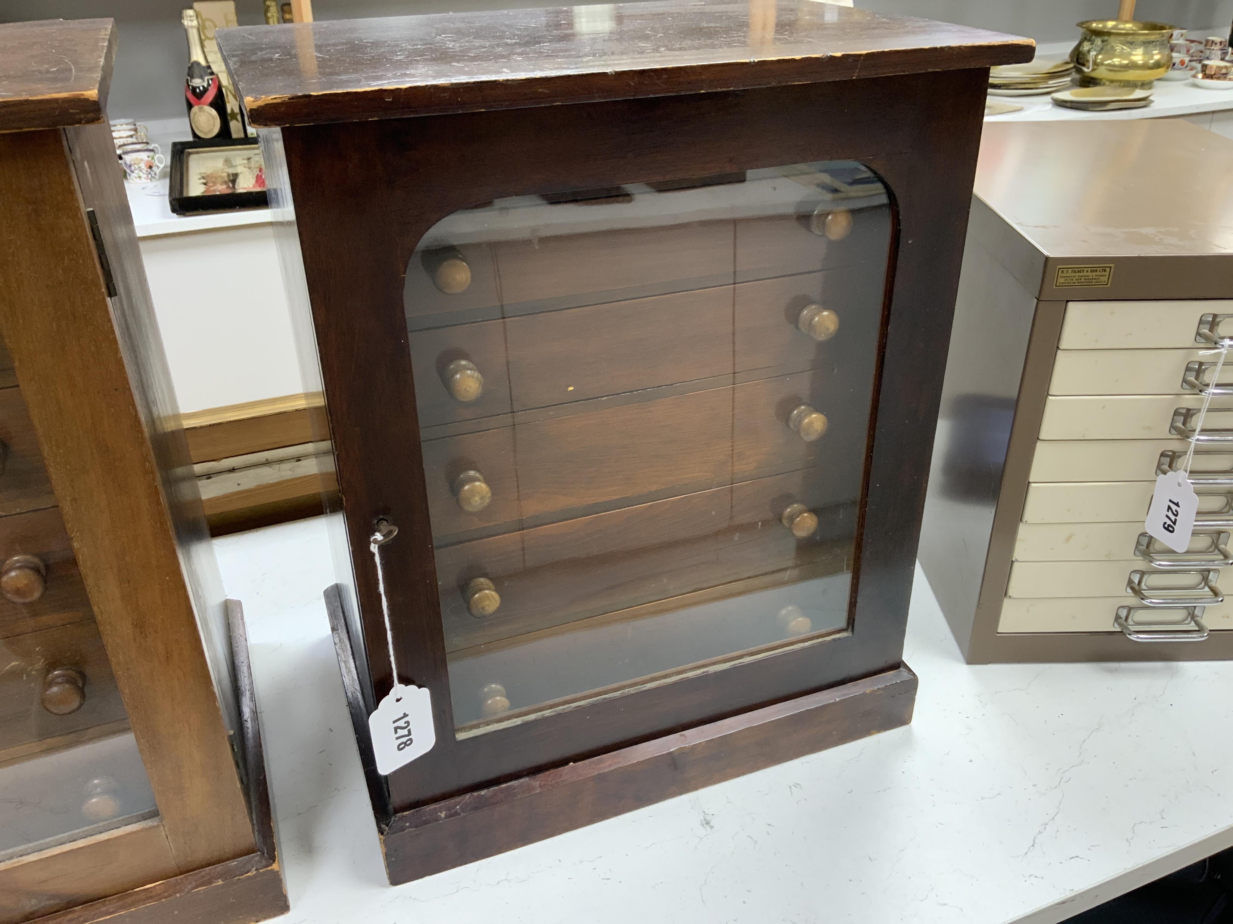 An early twentieth century six drawer pine collector’s cabinet of mineral and crystal samples including; Amber and insects in amber, Baryteson Calcite, Aplite, Nodular Rhyolite, Desert Roses, etc. many specimens with lab